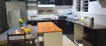 Master Bedroom with shared kitchen and living room