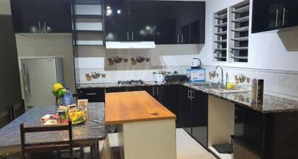 Master Bedroom with shared kitchen and living room