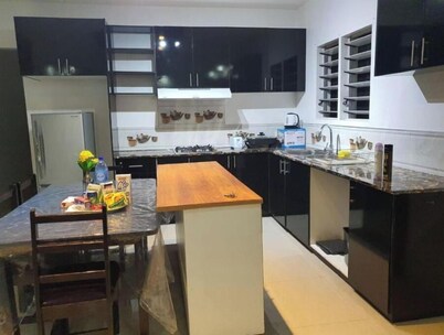 Master Bedroom with shared kitchen and living room