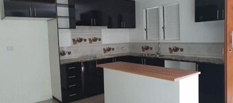 Master Bedroom with shared kitchen and living room