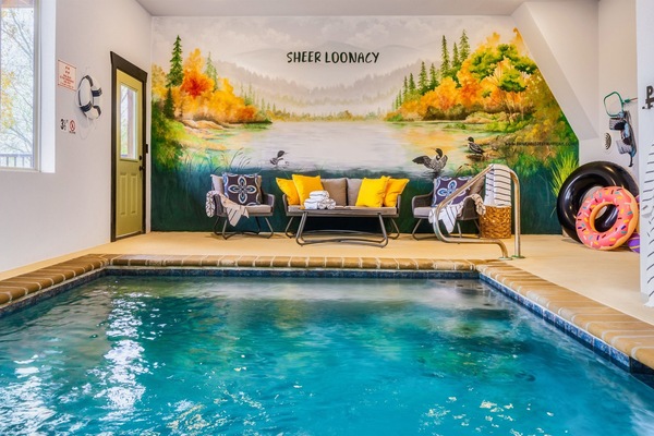 Enjoy a swim in our heated pool after a day of Smoky Mountain adventures. Sheer Loonacy's pool room features a custom mural of mountains and loons, of course.