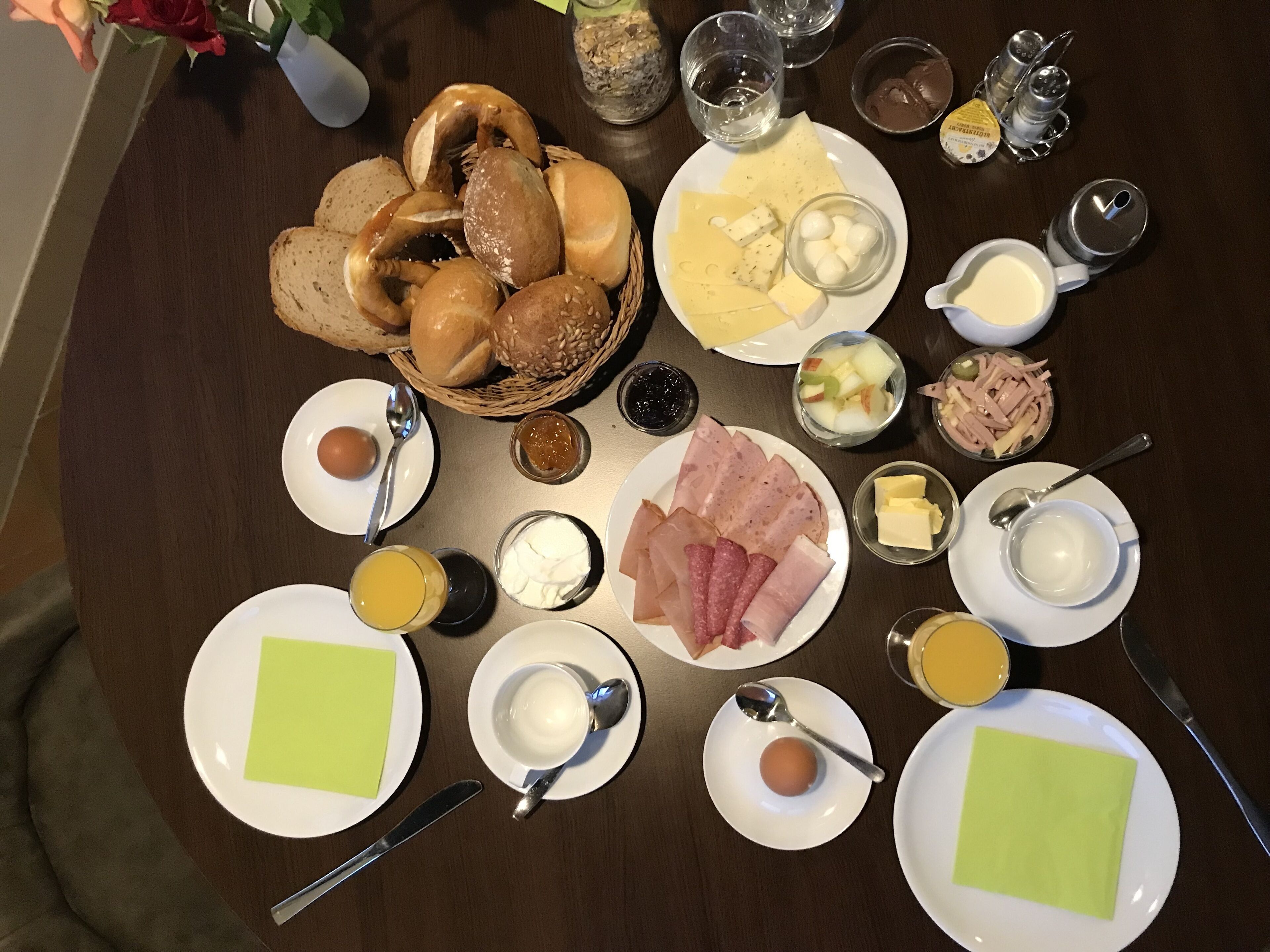 A breakfast buffet with various food items and condiments.