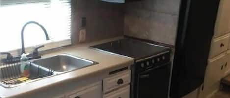 Fridge, microwave, stovetop, cookware/dishes/utensils