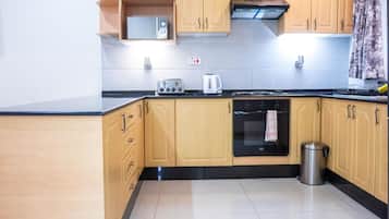 Microwave, oven, stovetop, dining tables