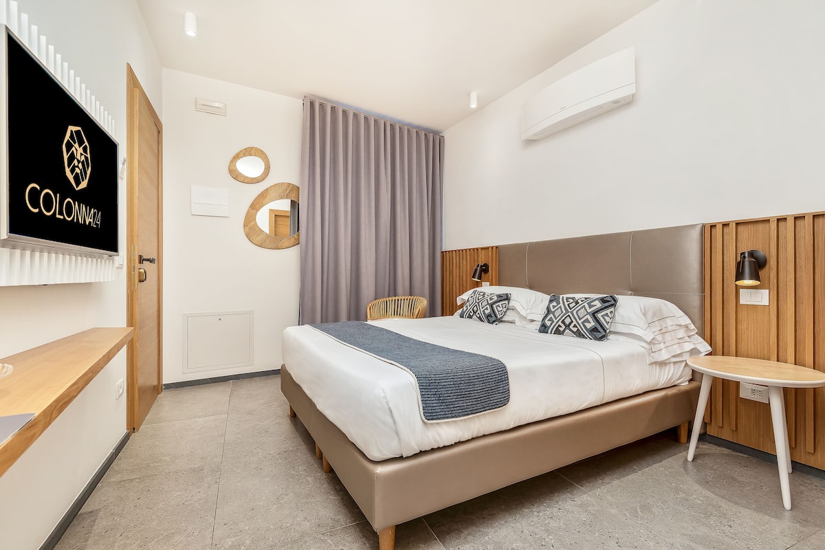Doppia Club | Minibar con snack e bevande gratuite, cassaforte in camera