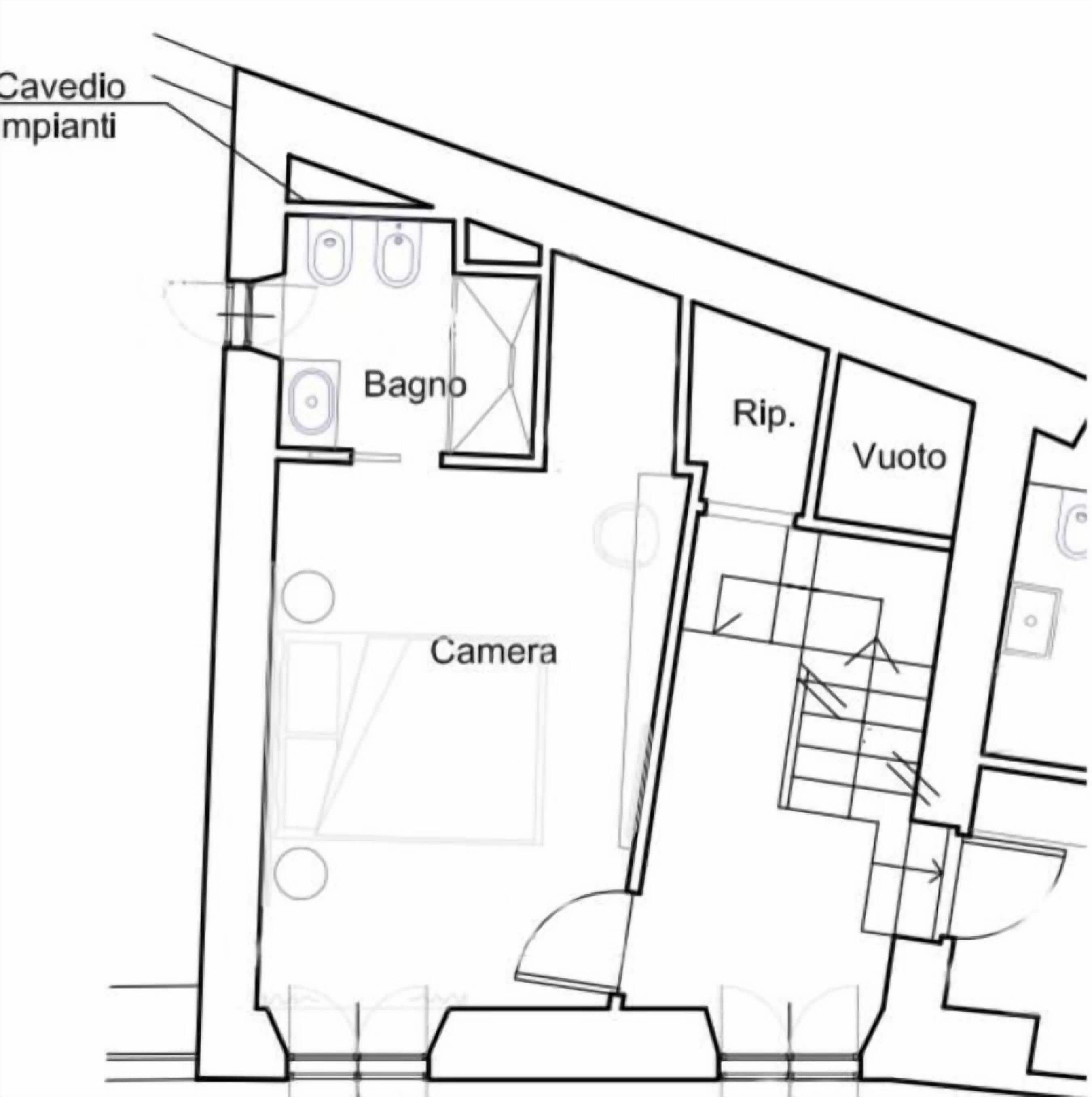 Un plan d’étage avec des pièces identifiées par des étiquettes, notamment une chambre, une salle de bain, un débarras et un espace vide.