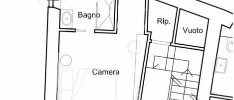 Plano de planta con habitaciones etiquetadas, incluyendo un Camerino, Baño, Ripiano y Espacio vacío.