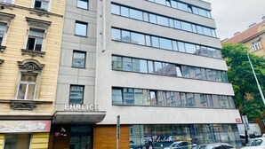 A multi-story building with a modern facade, featuring large windows and a prominent sign reading "EHRLICH". - Hotel Ehrlich Prague (Prague)