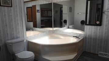 Combined shower/bathtub, towels, soap, shampoo