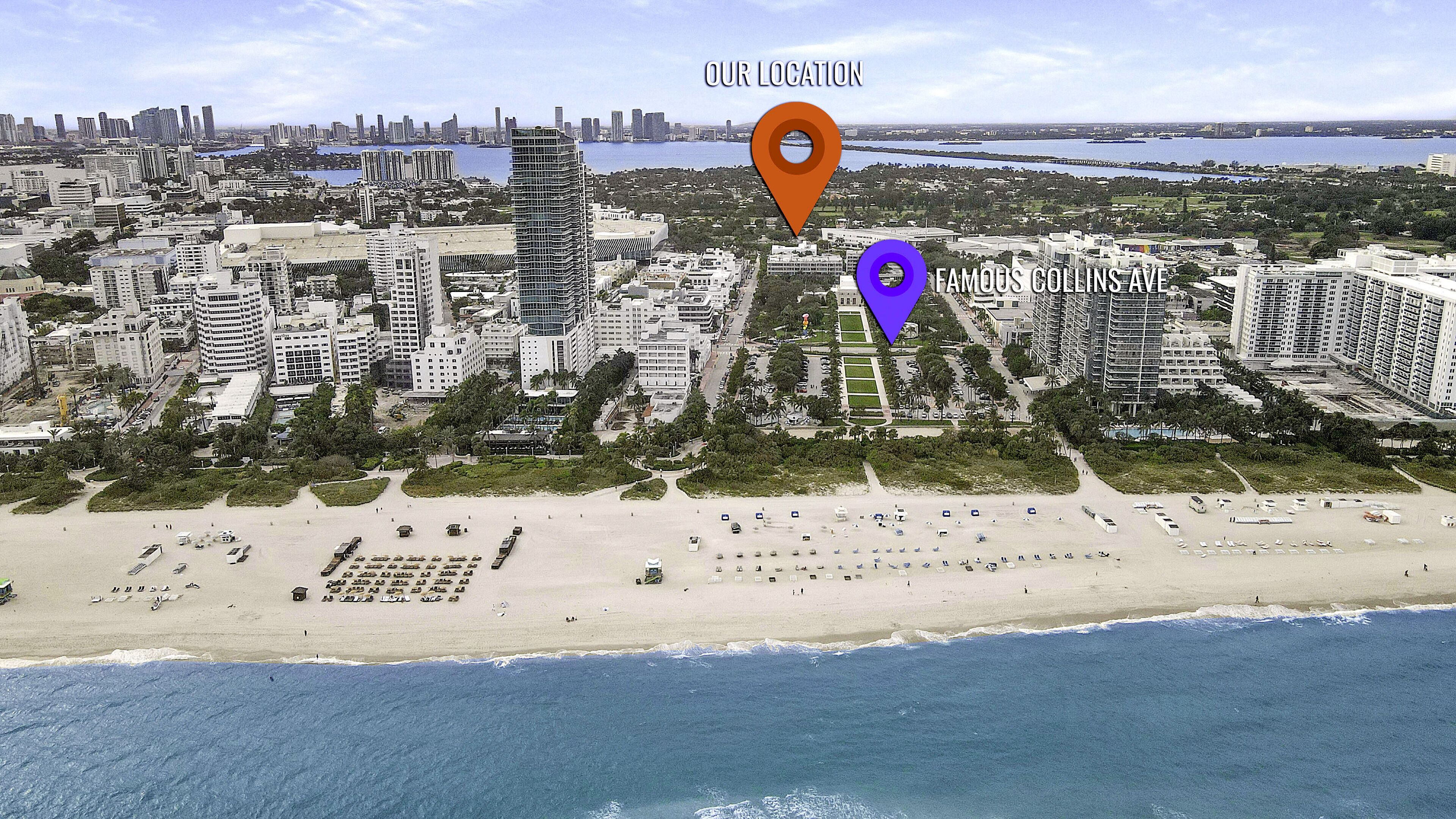 Vue aérienne d’une ville côtière avec de hauts immeubles, une plage et un port de plaisance.