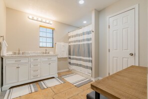 Combined shower/tub, hair dryer, towels, soap