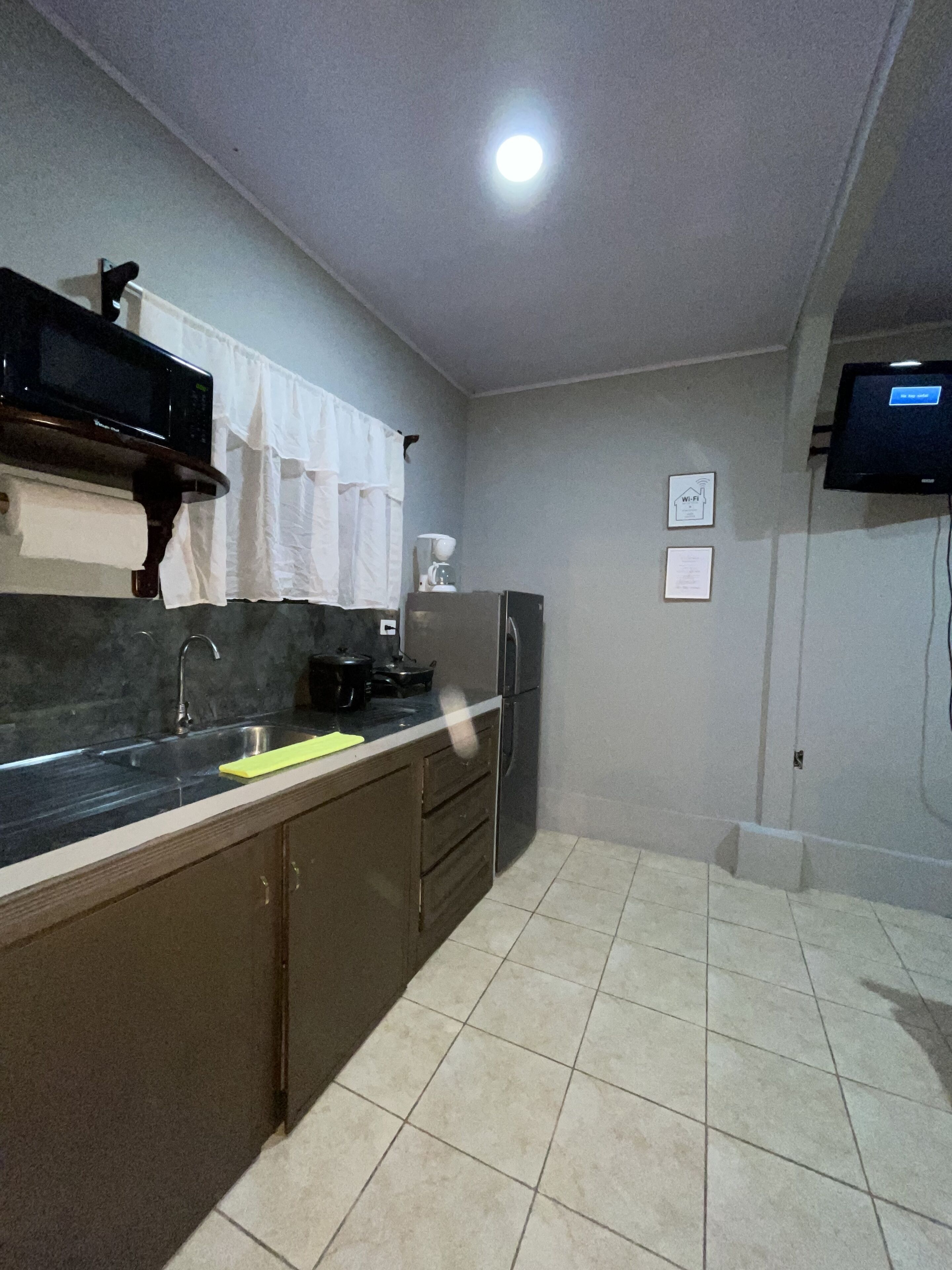 Microwave, coffee/tea maker, paper towels, dining tables