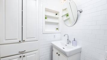 Combined shower/tub, hair dryer, towels, soap