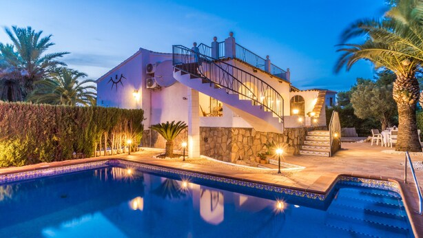 A two-story house with a pool, stone walls, and a staircase leading to the upper floor. - 2 Bedroom Villa in Landscaped Gardens (Javea / Xàbia)