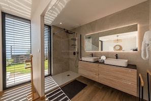 Shower, hair dryer, soap, toilet paper