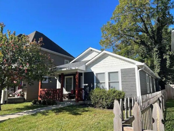 Stroll up to this charming home with a covered entryway and enjoy the serene surroundings.