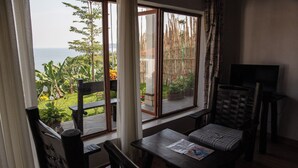 Habitación, 1 habitación, balcón, vistas al jardín | Zona de estar