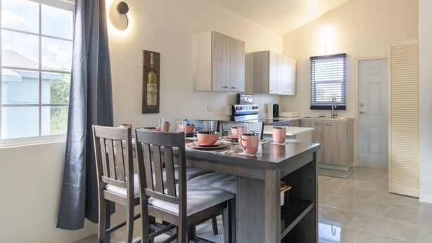 Bungalow, 2 Bedrooms, Patio, Ocean View | Dining room - Escape to Paradise: Brand New Bungalow With Ocean View in Discovery Bay (Discovery Bay)