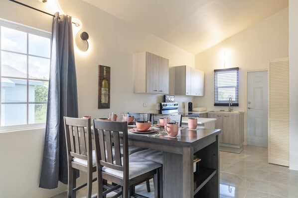 Bungalow, 2 Bedrooms, Patio, Ocean View | Dining room - Escape to Paradise: Brand New Bungalow With Ocean View in Discovery Bay (Discovery Bay)