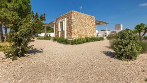 A stone building with a small garden area in front.