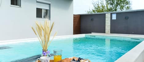 House (Four Bedroom Holiday Home with Swimmi) | Pool | Seasonal outdoor pool, pool umbrellas, pool loungers