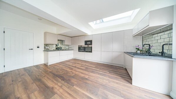 House, Multiple Beds | Private kitchen