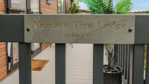 A sign for Meadow View Lodge with the name and location. - Plot 18 Meadow View (Morpeth)