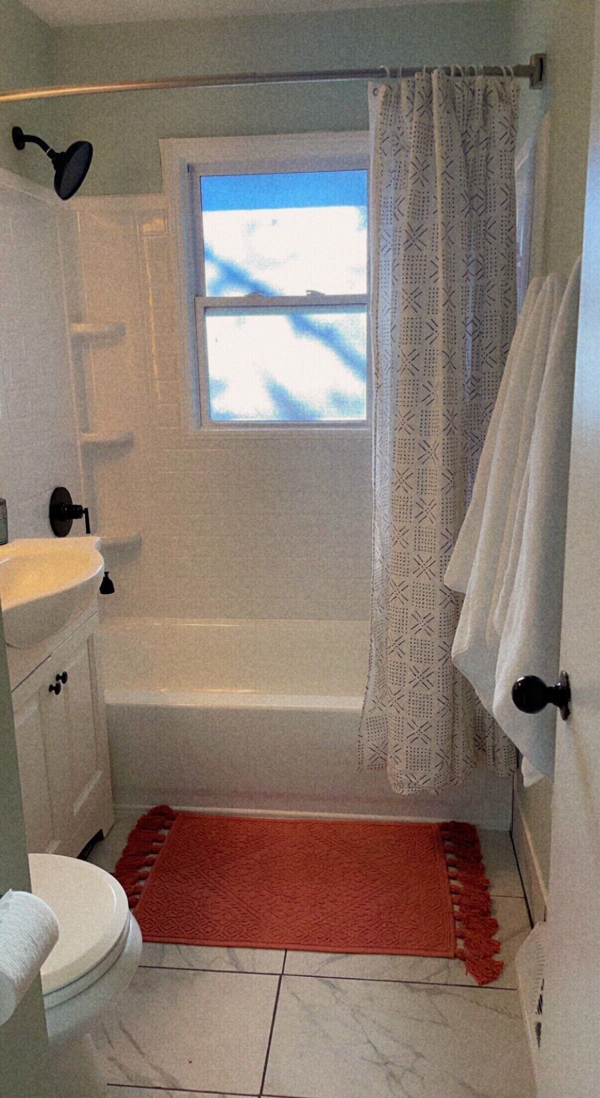 Combined shower/tub, hair dryer, towels, soap