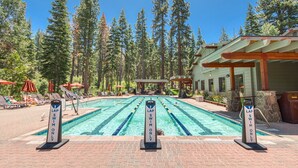 A swimming pool with lane markers and signs indicating 'Lap Swim Only' areas. - Rocky Point #14 by Tahoe Getaways - HOA Pool, Gym, Tennis & More! (Truckee)