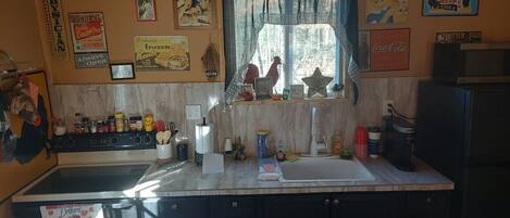 Fridge, microwave, cookware/dishes/utensils