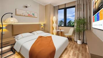 A hotel room with a bed, bedside table, lamp, chair, potted plant, and a window with curtains.