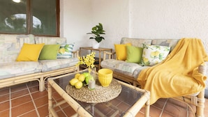 A cozy living area with two sofas, a small table, and a potted plant. - Stunning private villa for 9 guests with WIFI, A/C, private pool, TV, patio and pets allowed (Deltebre)