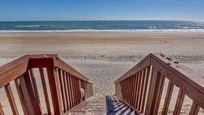 A wooden staircase leading to a beach with a clear view of the ocean. - Top Floor Oceanfront & Sound Views, Pool, (North Topsail Beach)