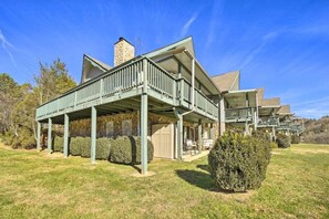 A large, two-story building with a covered porch and multiple balconies.