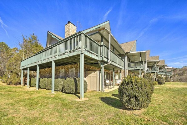 A large, two-story building with a covered porch and multiple balconies.