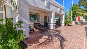 A covered outdoor patio with a seating area, a pool, and a view of the surrounding landscape. - WALK TO LA-WHITE SOX SP TRAINING 5MN DRIVE 2 STADIUM 1AC YARD +4Ksq ft HOME (Glendale)