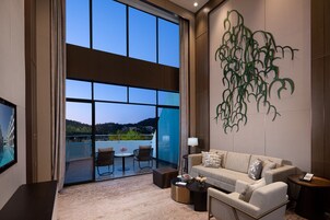 Deluxe Duplex | Living room | 55-inch LCD TV with cable channels