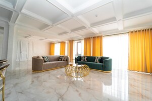 Presidential Suite | Living area | 45-inch TV with digital channels, heated floors