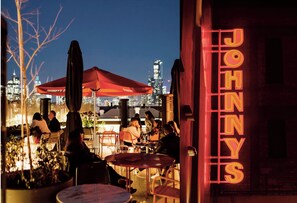 Outdoor dining - Cosmo Stays- 3BR Penthouse Apartment. Incredible City Views. Free Parking. (Carlton)