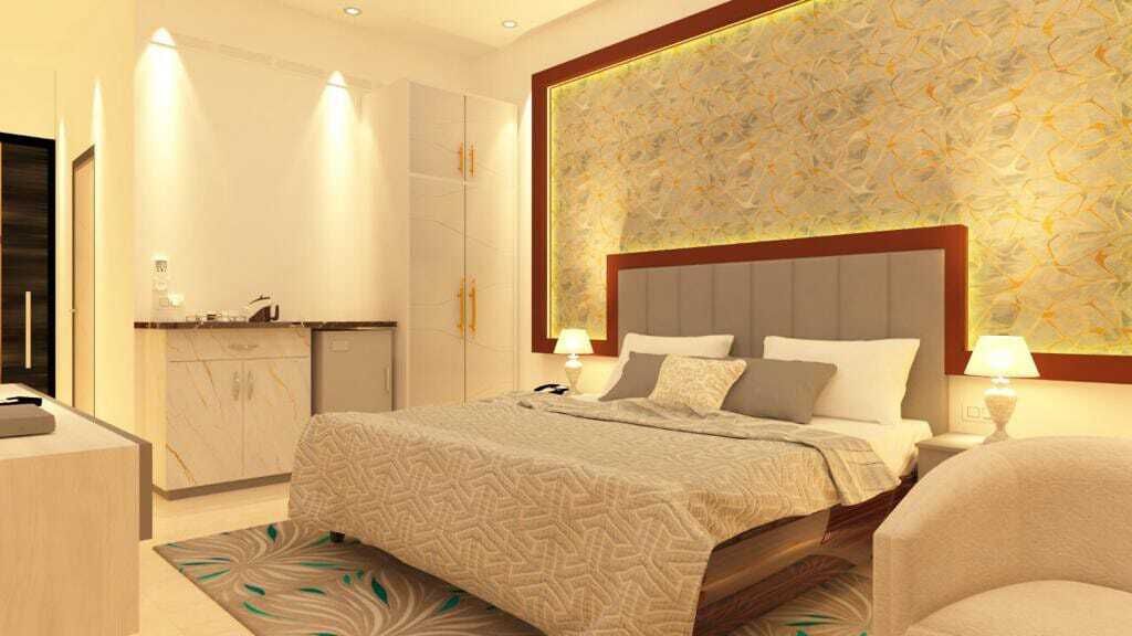A modern hotel room with a large bed, bedside lamps, a built-in wardrobe, and a decorative wall.