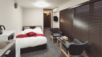 Deluxe Twin kamer (check in before 19:30) | Een bureau, gratis wifi, beddengoed