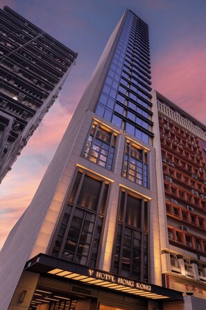 A modern hotel building with a prominent sign reading "HOTEL HONG KONG". - Y Hotel Hong Kong (Hong Kong)