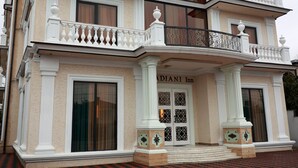 A multi-story hotel with a classic architectural style, featuring balconies, large windows, and a prominent entrance. - DADIANI Inn (Zugdidi)