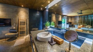 A modern bathroom with a large sink, a mirror, a potted plant, and a wooden ladder. - Love Supreme Villa by Betterplace (Canggu)