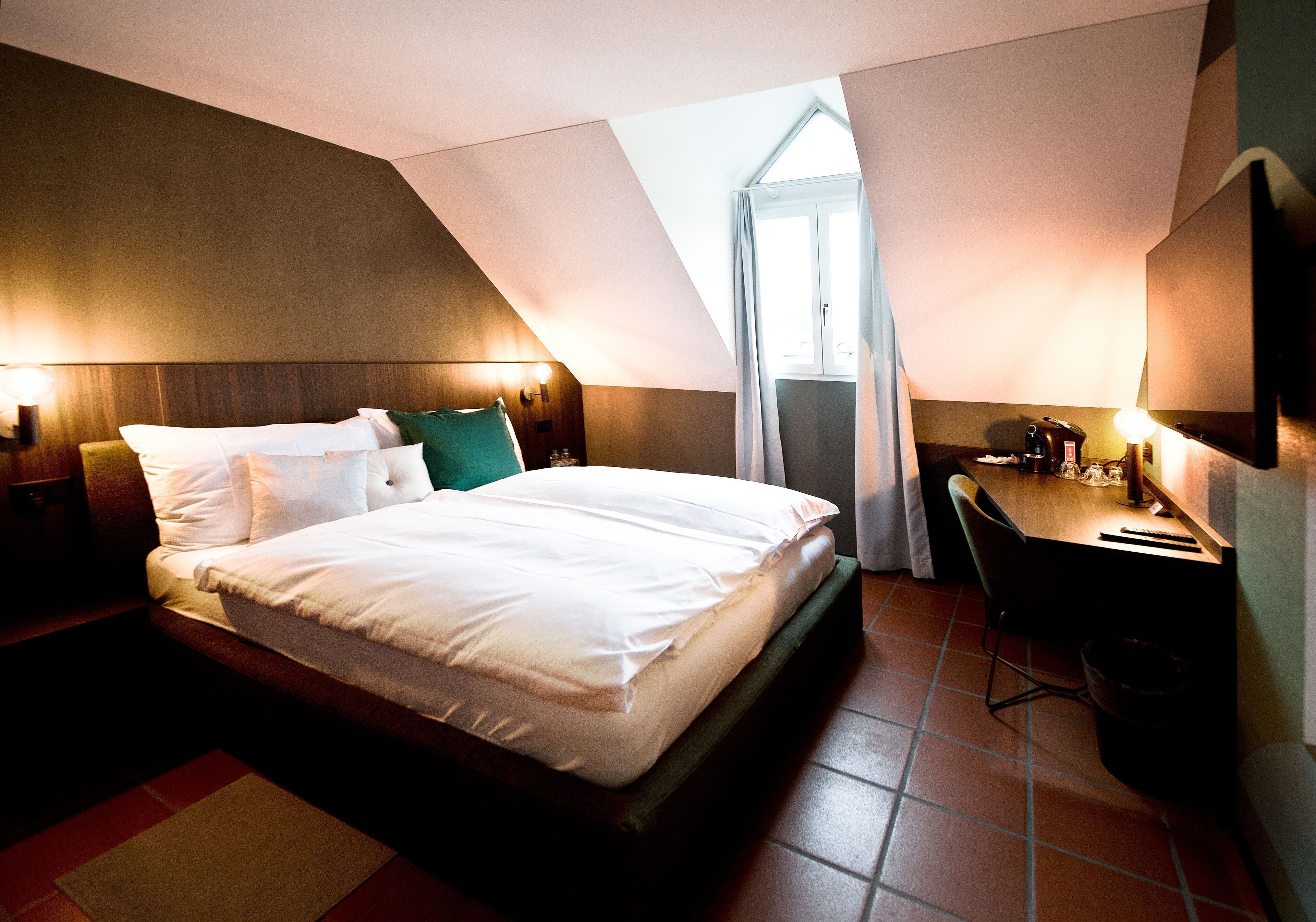 Premium bedding, desk, laptop workspace, blackout drapes