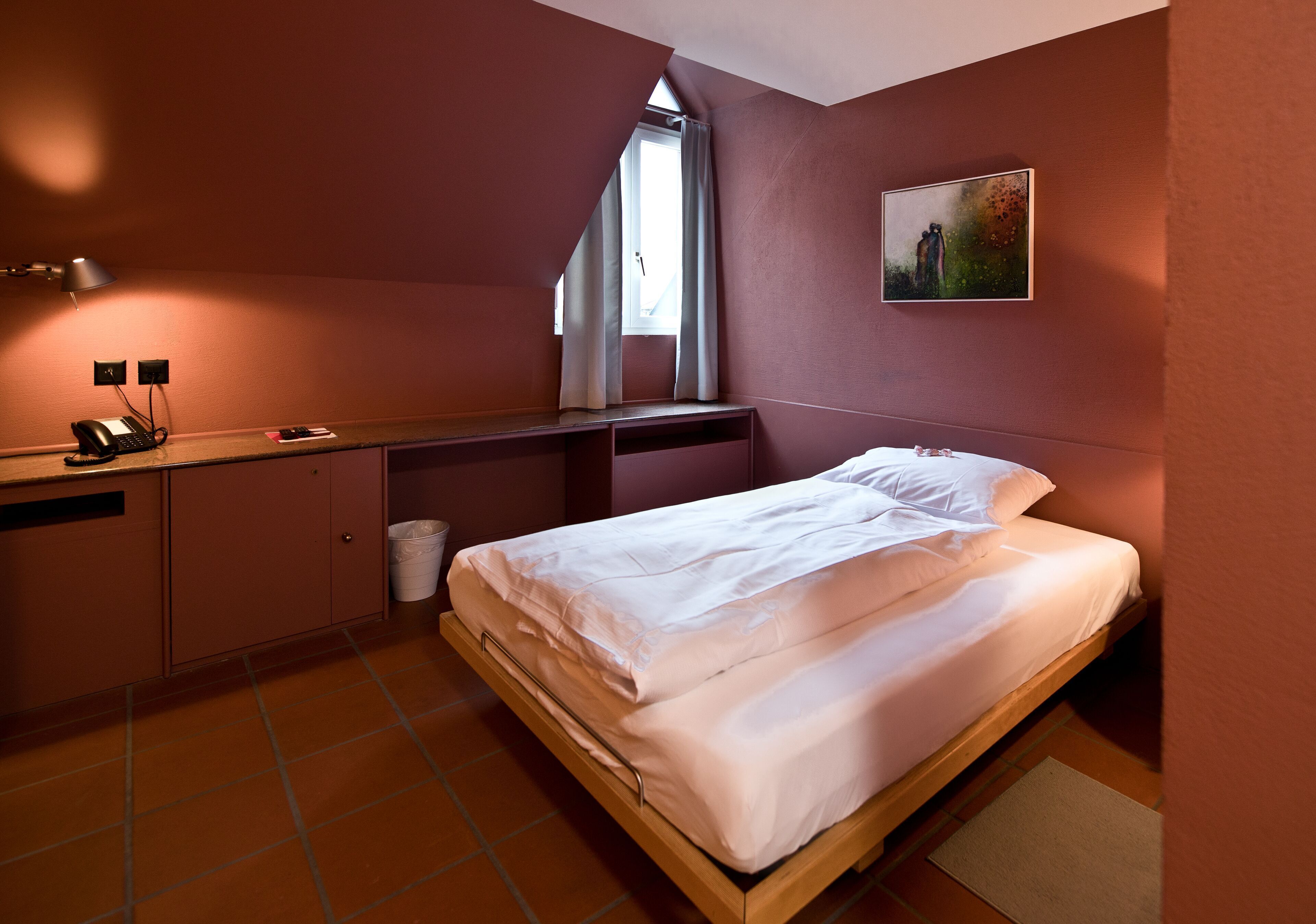 Premium bedding, desk, laptop workspace, blackout drapes