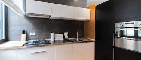Apartment (1 Bedroom) | Private kitchen | Oven, stovetop, dishwasher, highchair