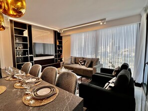 Deluxe Apartment | Living area | 43-inch flat-screen TV with cable channels, TV - High End & City View by FeelHome (Tel Aviv)
