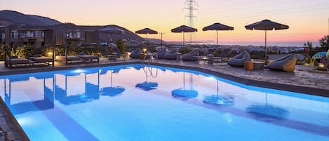 Outdoor pool, open 9:00 AM to 8:00 PM, pool umbrellas, pool loungers