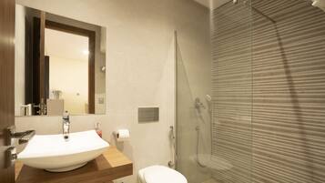 Shower, towels, soap, toilet paper